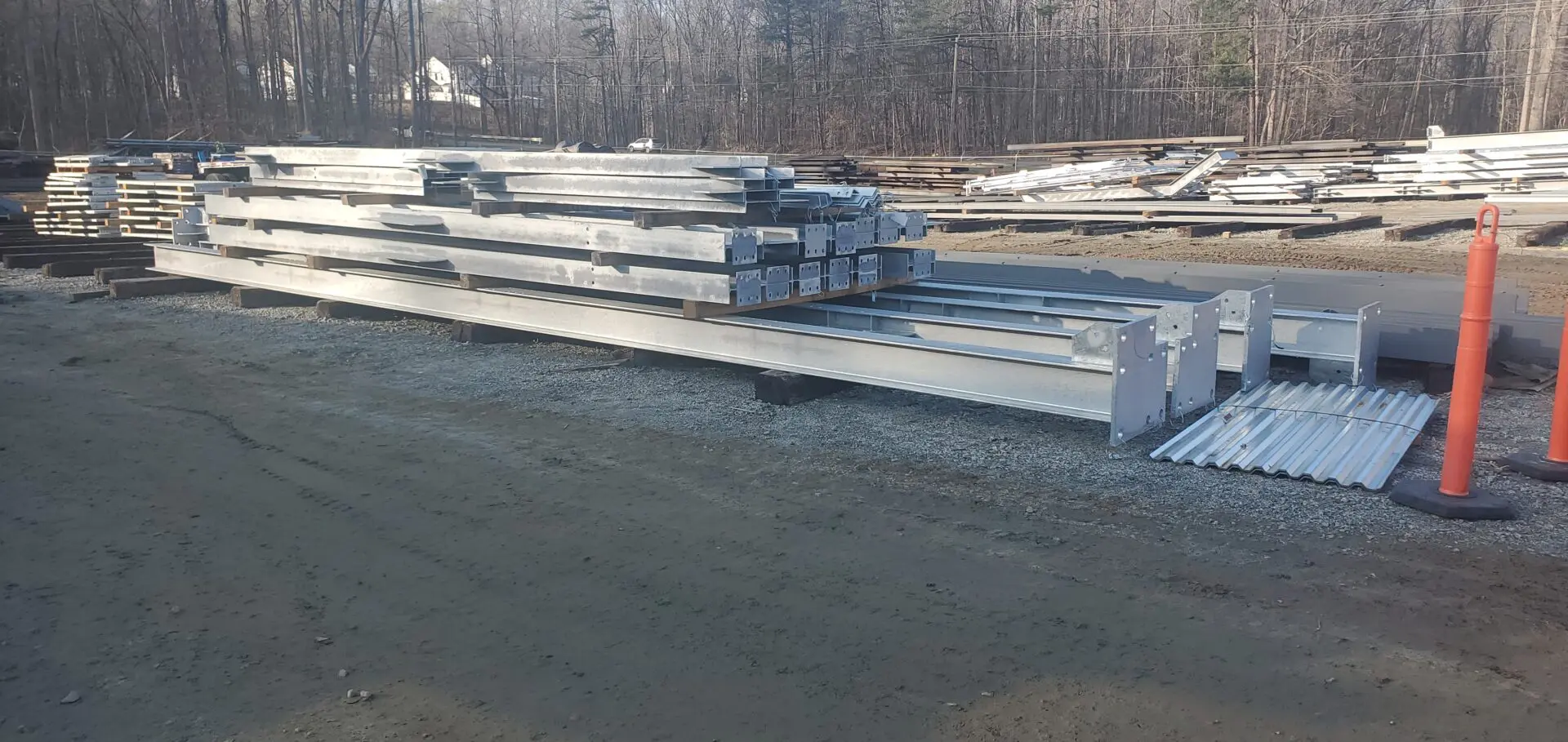 A stack of steel beams on the ground